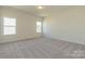 Bedroom with neutral carpet, bright windows, and blank walls ready for decor at 1150 Red River Dr, Salisbury, NC 28144