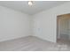 This bedroom features neutral walls, carpet and a door to the hallway at 1150 Red River Dr, Salisbury, NC 28144