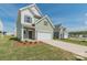 A charming two-story home with a two-car garage, front yard, and a well-manicured lawn at 1150 Red River Dr, Salisbury, NC 28144