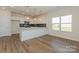 Modern kitchen featuring an island with white countertops, stainless steel appliances, and pendant lighting at 1150 Red River Dr, Salisbury, NC 28144
