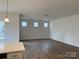 Living room area with three evenly spaced windows allowing for bright natural light at 1150 Red River Dr, Salisbury, NC 28144