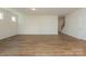 Spacious living room with hardwood floors and a staircase with white walls and natural light at 1150 Red River Dr, Salisbury, NC 28144
