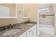 Bathroom with double vanity, granite countertop and tile shower at 13000 John Bostar Ln, Charlotte, NC 28215