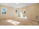 Spacious bedroom with sunlight and access to bath at 13000 John Bostar Ln, Charlotte, NC 28215