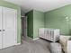 Bedroom with a crib and closet at 18014 Pear Hawthorne Dr, Huntersville, NC 28078