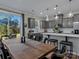 Bright dining area with wooden table and view of backyard at 18014 Pear Hawthorne Dr, Huntersville, NC 28078