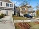 Townhome exterior, driveway, and a car parked in front at 18014 Pear Hawthorne Dr, Huntersville, NC 28078