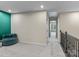Upper hallway with teal accent wall and view of bedroom at 18014 Pear Hawthorne Dr, Huntersville, NC 28078