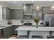 Modern kitchen with gray cabinets, white countertops, and island at 18014 Pear Hawthorne Dr, Huntersville, NC 28078