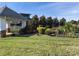Landscaped area with a gazebo and flowers at 18014 Pear Hawthorne Dr, Huntersville, NC 28078