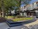 Landscaped town square with shops and trees at 18014 Pear Hawthorne Dr, Huntersville, NC 28078