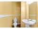 Simple bathroom with pedestal sink and toilet at 18819 Cloverstone Cir, Cornelius, NC 28031