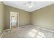 Bedroom with carpet, ceiling fan and adjacent bath at 18819 Cloverstone Cir, Cornelius, NC 28031