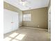 Bright bedroom with carpet flooring and double doors at 18819 Cloverstone Cir, Cornelius, NC 28031