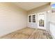 Private deck with wood flooring and access door at 18819 Cloverstone Cir, Cornelius, NC 28031