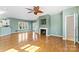 Open living area with hardwood floors and a fireplace at 18819 Cloverstone Cir, Cornelius, NC 28031