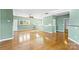 Large living room with hardwood floors and lots of natural light at 18819 Cloverstone Cir, Cornelius, NC 28031