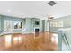 Bright living room featuring hardwood floors and a fireplace at 18819 Cloverstone Cir, Cornelius, NC 28031