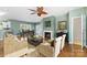 Spacious living room with hardwood floors, fireplace, and access to balcony at 18819 Cloverstone Cir, Cornelius, NC 28031