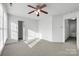 Spacious bedroom with neutral carpet, walk-in closet, and attached bathroom at 2318 Sweet Flag Ct, Charlotte, NC 28262