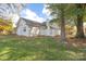 Charming home with a large backyard, mature trees, and white picket fence at 2702 New Hamlin Way, Charlotte, NC 28210