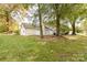 Spacious backyard featuring a well-maintained lawn and a classic white picket fence at 2702 New Hamlin Way, Charlotte, NC 28210