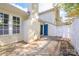Residential backyard featuring a patio, white picket fence and mature trees, offering privacy at 2702 New Hamlin Way, Charlotte, NC 28210