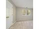 Bright bedroom featuring a large window, neutral paint, and plush carpet at 2702 New Hamlin Way, Charlotte, NC 28210