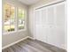 Bedroom with natural light, hardwood floors, and spacious closet at 2702 New Hamlin Way, Charlotte, NC 28210
