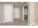 Welcoming foyer with neutral carpet, fresh paint, and a view to the next room at 2702 New Hamlin Way, Charlotte, NC 28210