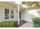 Inviting front entrance with covered porch, blue door, and decorative columns at 2702 New Hamlin Way, Charlotte, NC 28210