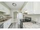 Well-lit kitchen featuring stainless steel appliances and modern countertops at 2702 New Hamlin Way, Charlotte, NC 28210