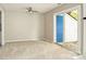 Cozy carpeted living room with ceiling fan and sliding glass door to backyard at 2702 New Hamlin Way, Charlotte, NC 28210