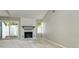 Bright living room with fireplace and sliding glass doors to the backyard at 2702 New Hamlin Way, Charlotte, NC 28210