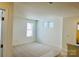 Bright room featuring carpet flooring and ample natural light from multiple windows in the space at 3031 Puddle Pond Rd, Indian Trail, NC 28079