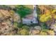 Aerial view of a Ranch style home with deck, surrounded by trees at 1500 Beth Haven Church Rd, Denver, NC 28037