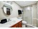 Basement bathroom with a walk-in shower and wood vanity at 1500 Beth Haven Church Rd, Denver, NC 28037