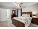 Spacious bedroom with a dark brown bed frame and ceiling fan at 1500 Beth Haven Church Rd, Denver, NC 28037