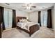 Bedroom with dark brown bed frame and ceiling fan at 1500 Beth Haven Church Rd, Denver, NC 28037
