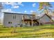 Two-story home with deck, fenced yard, and wooded area at 1500 Beth Haven Church Rd, Denver, NC 28037
