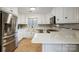 Modern kitchen with white cabinets, stainless steel appliances, and quartz countertops at 1500 Beth Haven Church Rd, Denver, NC 28037
