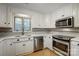 Modern kitchen with white cabinets and stainless steel appliances at 1500 Beth Haven Church Rd, Denver, NC 28037