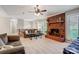 Living room with brick fireplace, comfy seating, and a large TV at 1500 Beth Haven Church Rd, Denver, NC 28037