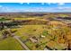 Aerial view of house with pool and surrounding farmlands at 4723 Old Mountain Rd, Stony Point, NC 28678