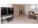 Finished basement recreation area with fireplace and large TV at 4723 Old Mountain Rd, Stony Point, NC 28678