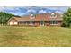Brick home with a double garage and well-manicured lawn at 4723 Old Mountain Rd, Stony Point, NC 28678