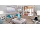 Comfortable living room with light and airy decor and hardwood floors at 4723 Old Mountain Rd, Stony Point, NC 28678