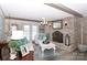 Living room with a brick fireplace and comfortable seating area at 4723 Old Mountain Rd, Stony Point, NC 28678