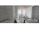 Bathroom with subway tile, freestanding tub, granite countertops, and modern fixtures at 536 Robinhood Rd # 27, Maiden, NC 28650