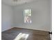 Bright bedroom featuring hardwood floors, white walls, and a window offering natural light at 536 Robinhood Rd # 27, Maiden, NC 28650